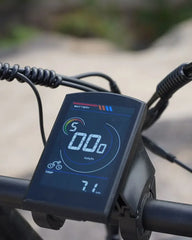 Digital display on a OTIDA R7 MAX Dual Motor Electric Bike handlebar with battery and speed information.