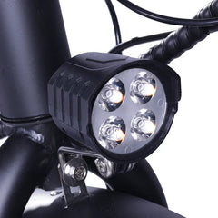 Motorcycle light fixture with four LED lights on a black background
