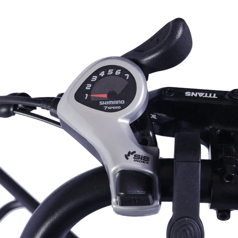 Close-up of a bicycle gear shifter with Shimano branding on a white background