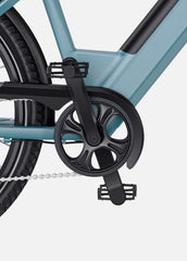 Close-up of a bicycle's gear system on a light gray background