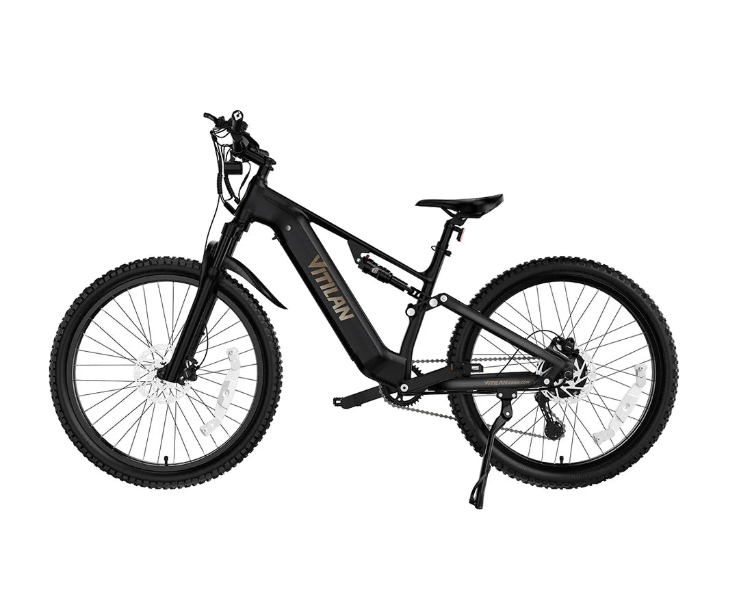 A black VITILAN M5 electric mountain bike with fat tires, front suspension fork, and a gold brand logo on the frame, shown on a solid white background.